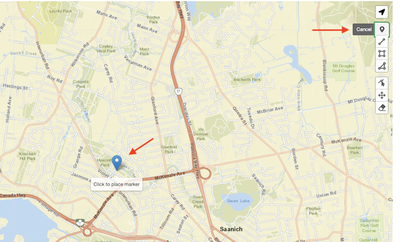 A pin placed on a map with a red arrow pointing to it